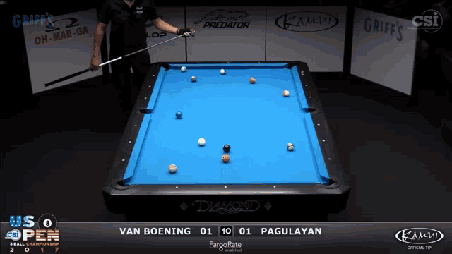 a pool table with a blue cloth and balls on it