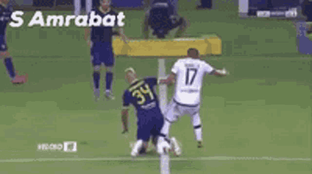 two soccer players on a field with the words samrabat on the bottom