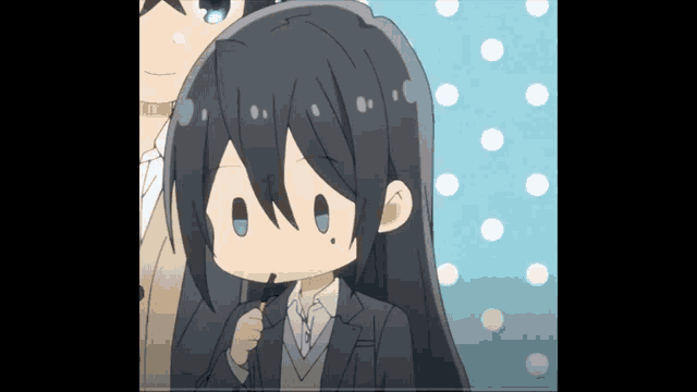 a girl with long black hair is holding a candy bar