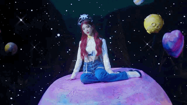 a woman with red hair is sitting on top of a pink planet surrounded by planets .