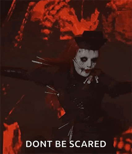 a woman in a scary costume is holding a gun and says " dont be scared "