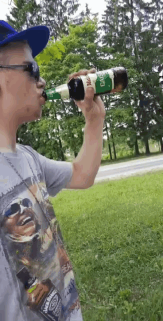 a man drinking from a bottle of jack daniel 's