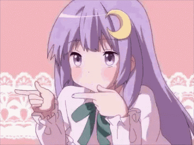 a girl with purple hair and a crescent moon on her head is pointing at the camera .