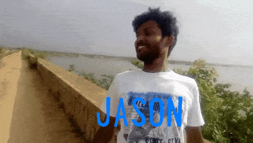 a man wearing a white shirt with the name jason on it