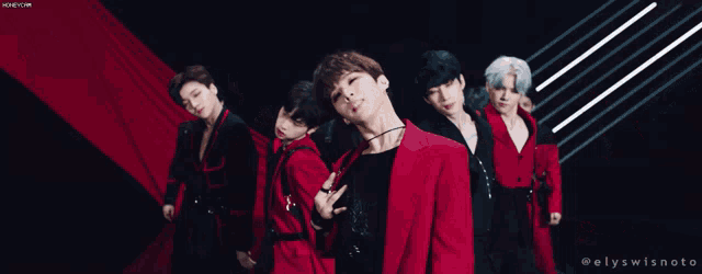 a group of young men wearing red jackets and black jackets