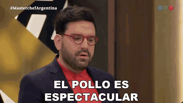 a man in a suit and red shirt says el pollo es espectacular