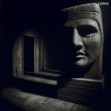 a black and white photo of a statue with luma written on the bottom left