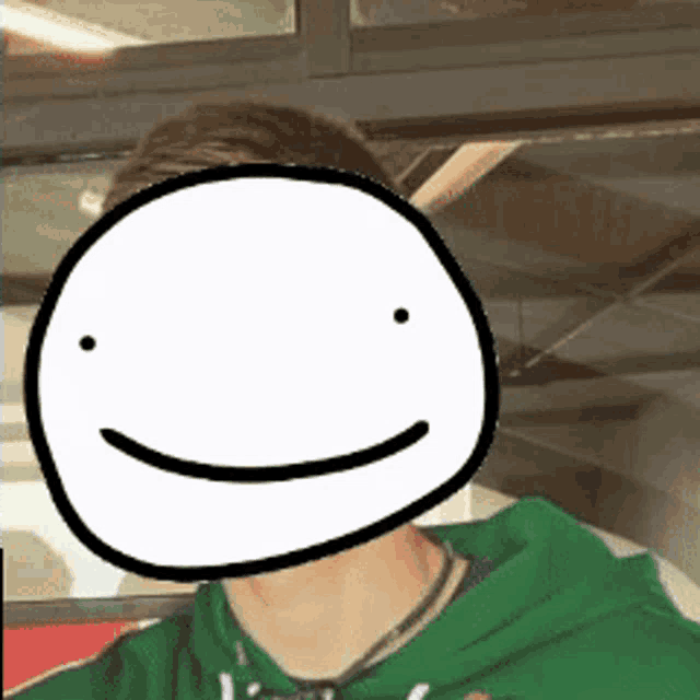 a man in a green hoodie has a cartoon face on his face