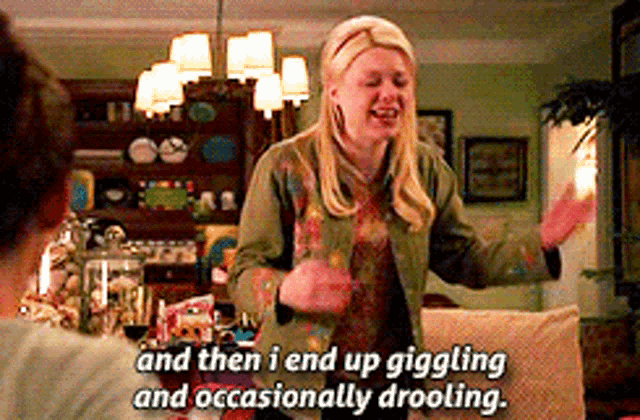 a woman is dancing in a living room with the words and then i end up giggling and occasionally drooling