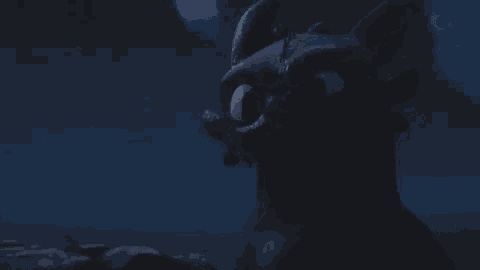 a close up of a toothless from how to train your dragon looking at the camera .