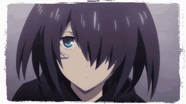 a girl with black hair and blue eyes looks at the camera