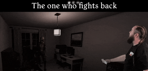 a man is standing in a dark room with the words the one who fights back above him