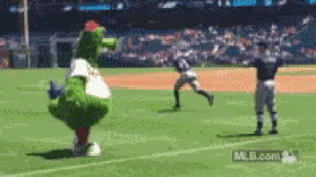 a mascot on a baseball field with mlb.com on the bottom right