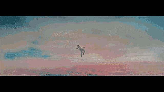 a man with his eyes closed is looking up at the sky