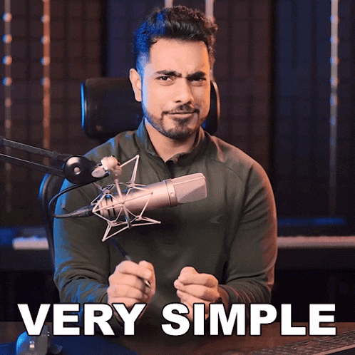 a man sitting in front of a microphone with the words " very simple " below him