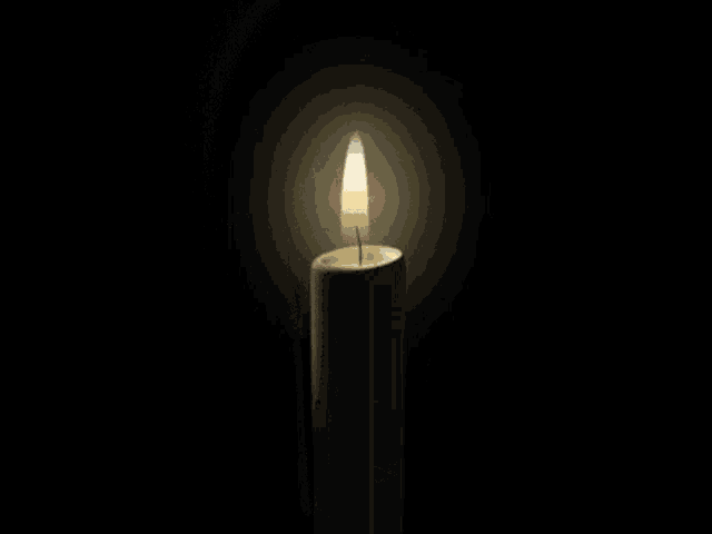 a white candle with a picture of a girl on it