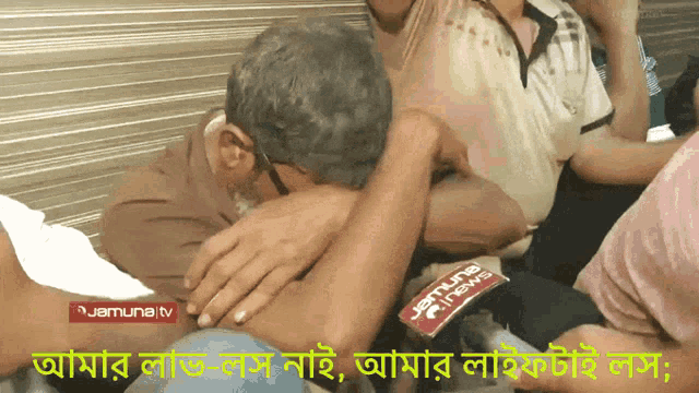a man is being interviewed by a jamuna tv