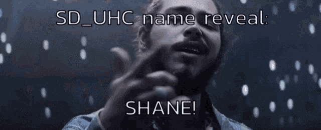 a man with a beard and a ring on his finger says sd_uhc name reveal shane !