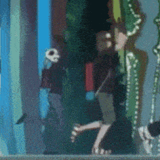 a blurry picture of a person walking in a room