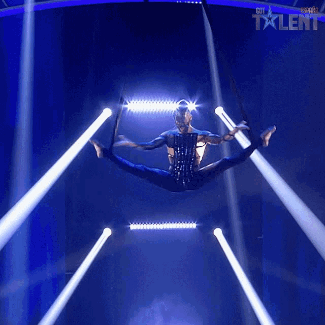 a man is doing a split in the air and the word talent is on the bottom