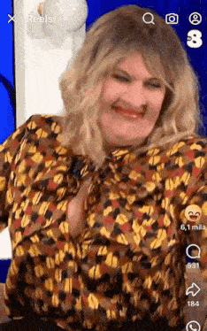 a woman in a leopard print shirt is making a funny face on a video .