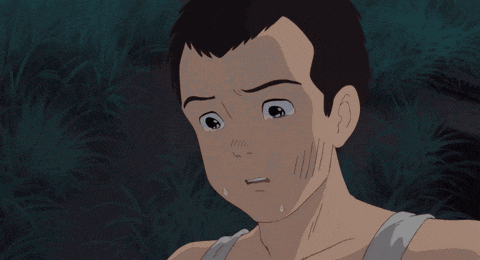 a close up of a man 's face with a tear running down his cheek