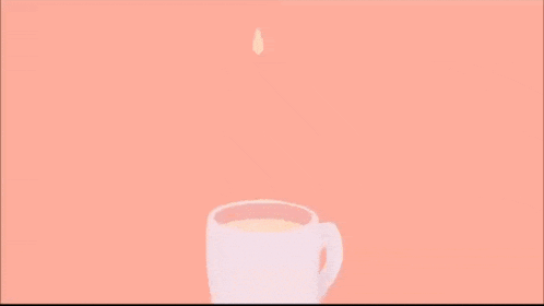 a cup of coffee with a drop of milk coming out of it