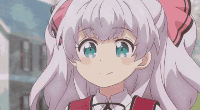 a girl with a pink bow on her hair is smiling
