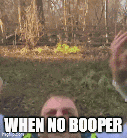 a man with a beard says when no booper in front of a fence
