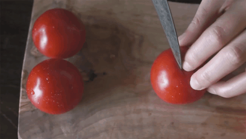 Score The Top Of The Tomato With A Cross Two Plaid Aprons GIF - Score The Top Of The Tomato With A Cross Two Plaid Aprons Make An X Mark On The Top Of The Tomato GIFs