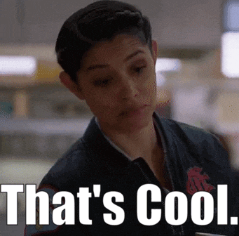 a woman is wearing a jacket with the words `` that 's cool '' on it .