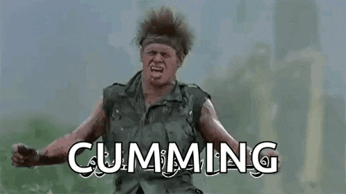 a man in a military uniform is standing in a field with his arms outstretched and the word cumming written above him .