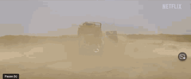 a netflix advertisement shows a man laying on the ground with a car on top of him