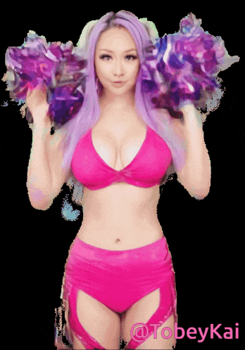 a woman in a pink bikini is holding purple pom poms and the name tobeykai is on the bottom right