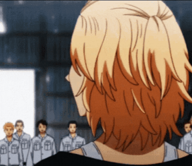 the back of a person 's head is shown in front of a group of men .