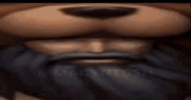 a close up of a teddy bear 's face with a beard .