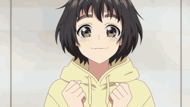 a girl with short black hair is wearing a yellow sweatshirt