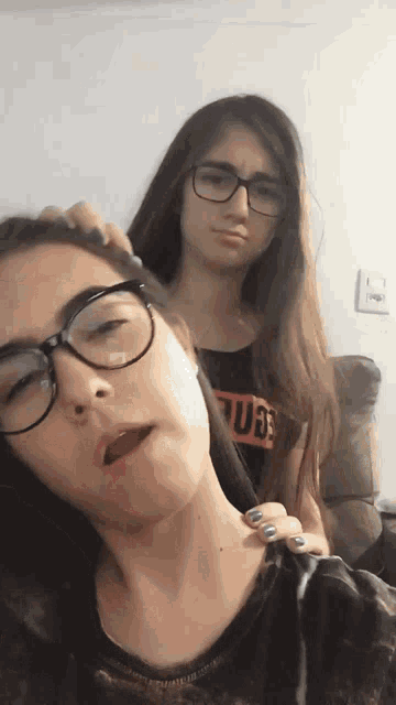 two girls wearing glasses and a shirt that says ' pornhub '