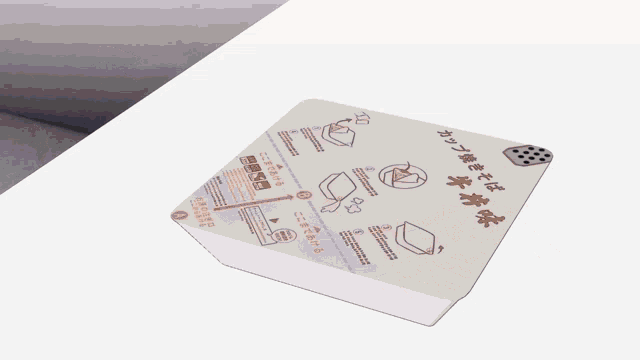 a person holding a piece of paper with chinese writing