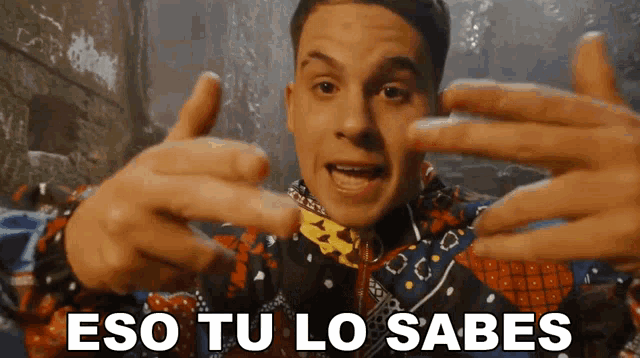 a man making a funny face with the words eso tu lo sabes written below him