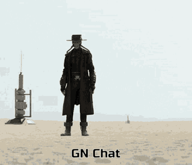 a man in a trench coat and hat is standing in the desert with the words gn chat written below him