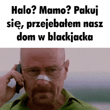 a man with glasses and a bandage on his nose talks on a cell phone