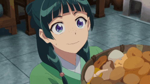 a girl in a green shirt holds a basket of food