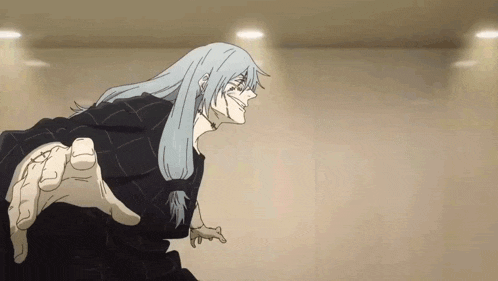 a man with long blue hair is standing in a room with a hand reaching out .