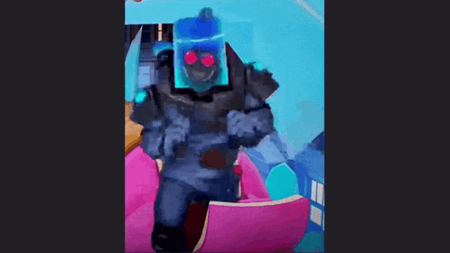 a cartoon character is holding a gun and wearing a helmet with red eyes .