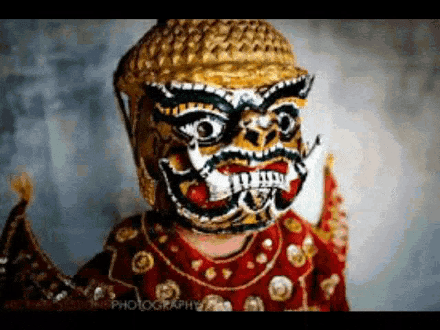 a close up of a person wearing a colorful mask