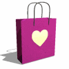 a pink shopping bag with a gold heart on it