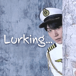 a man in a military uniform is peeking out from behind a wall with the words lurking written on the bottom