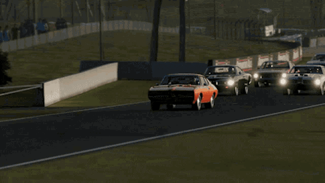 a red car is driving down a race track