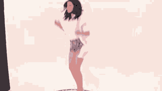a woman in a white shirt and shorts is dancing